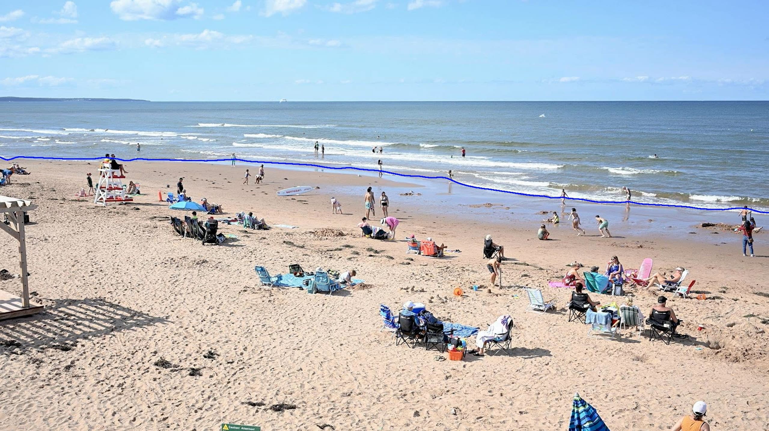 AI shoreline detection with boundary lines monitoring a busy beach